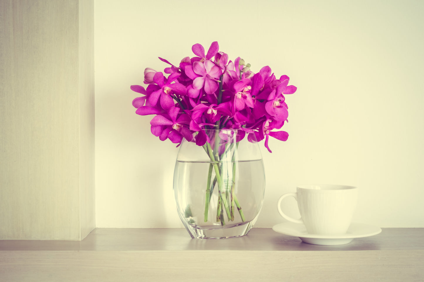 Round Glass Flower Vase with Purple Flowers